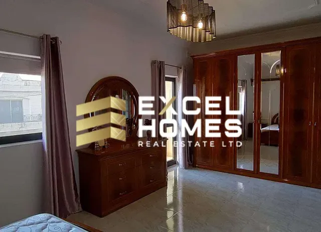 a room with a bed and a mirror