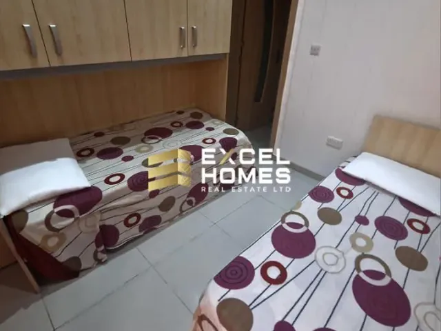 a bed with a blanket and a pillow on it