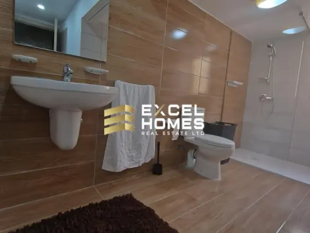 a bathroom with a toilet, sink, and bathtub