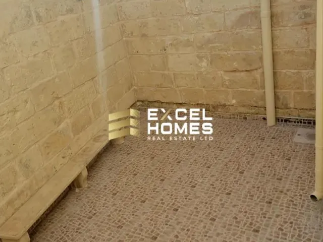 a wall with a wall of toilet paper and a wall of graffiti