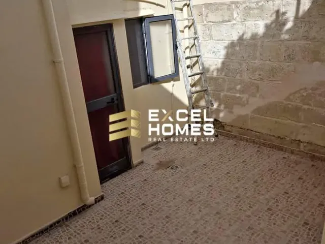 a door is open to a small room with a door open