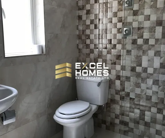 a bathroom with a toilet and a sink