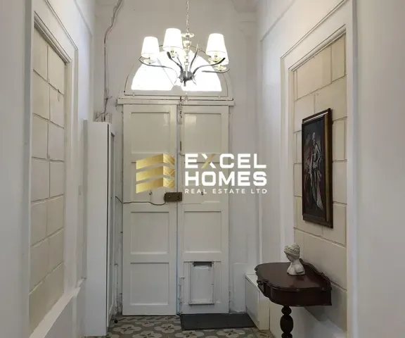 a bathroom with a mirror and a sink