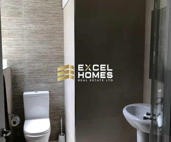 a bathroom with a toilet and a sink