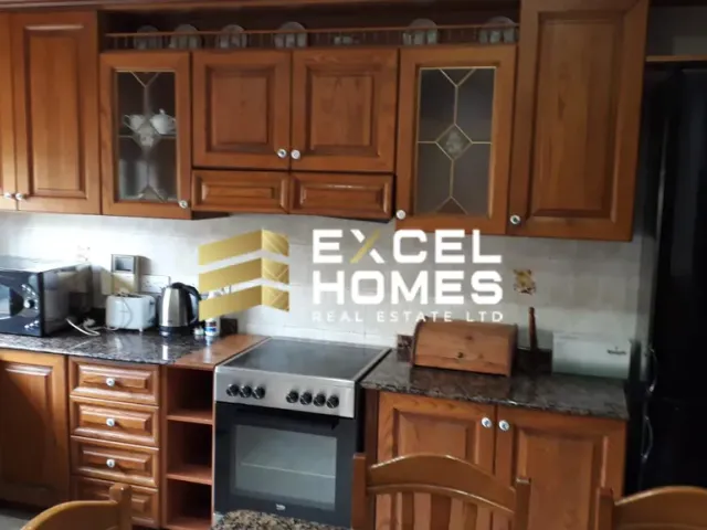 a kitchen with a stove, microwave, sink and refrigerator