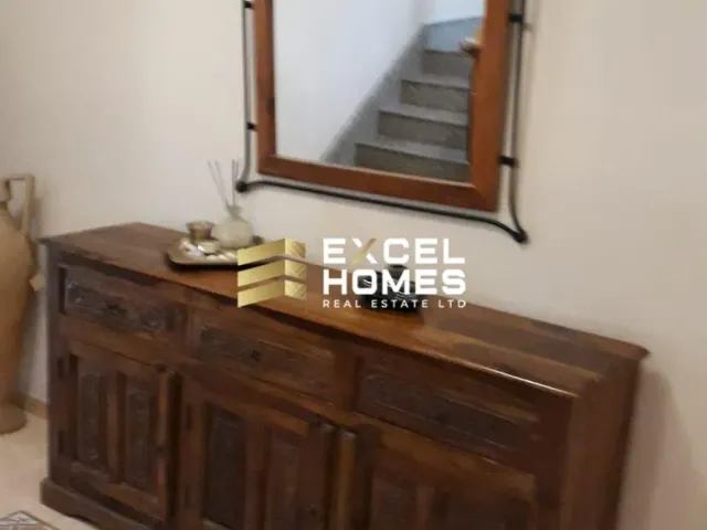 a mirror on a wall with a picture of a woman