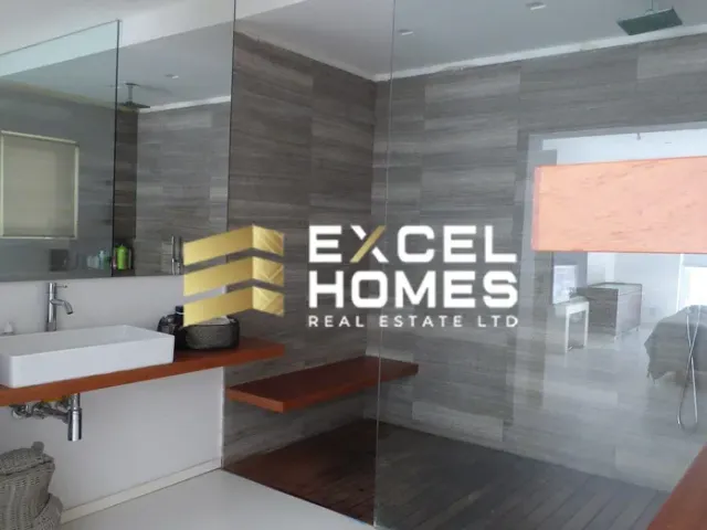 a bathroom with a large mirror and a large window 