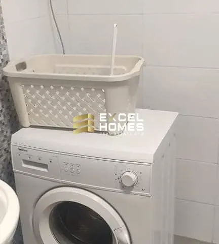 a white toilet sitting in a bathroom next to a sink