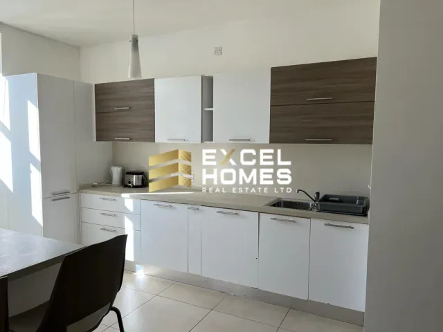 a kitchen with a sink, stove, and refrigerator 