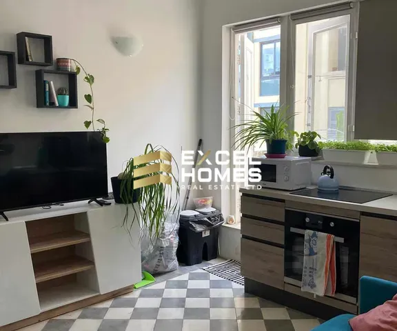 a kitchen with a sink, a window, and a counter top 