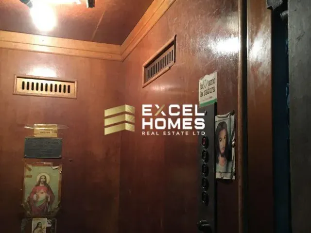 a bathroom with a sign on the wall