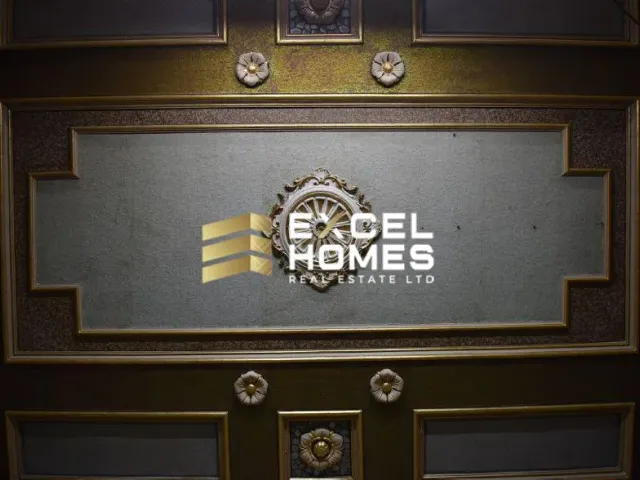 a clock on a wall with a picture of a man on it