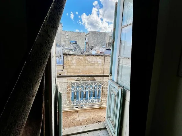a window with a view of a city 