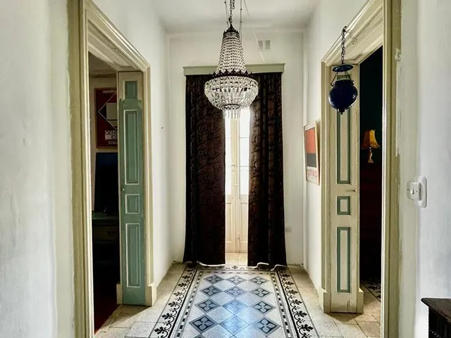 a large room with a clock on the wall 
