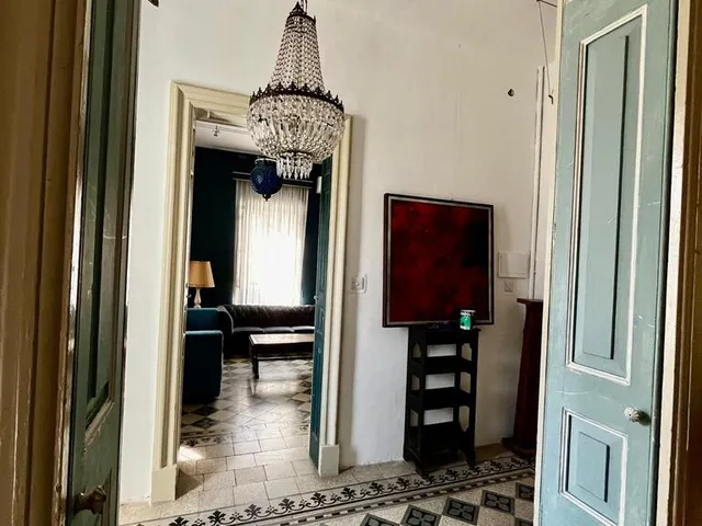 a kitchen with a door open and a door open 