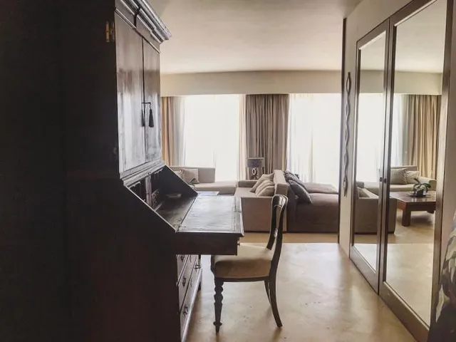 a living room with a table and chairs