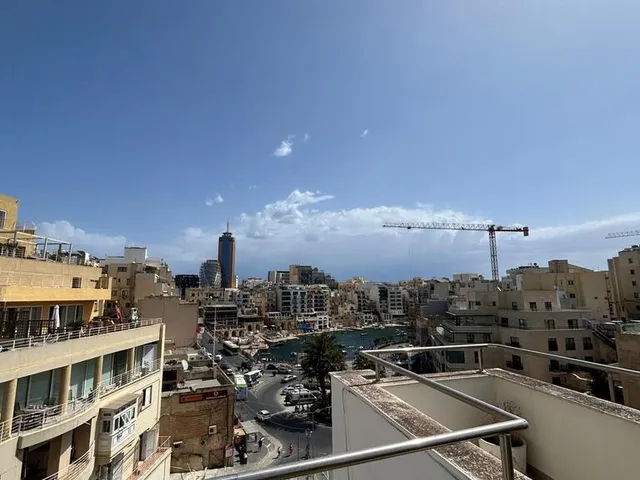a city with a lot of buildings and a sky background