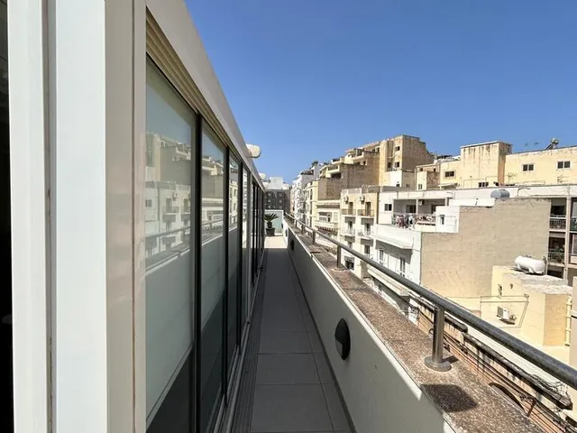a view from a window of a building with a view of a city