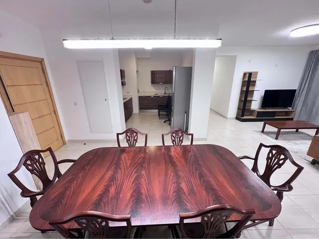 a dining room table with a wooden table top