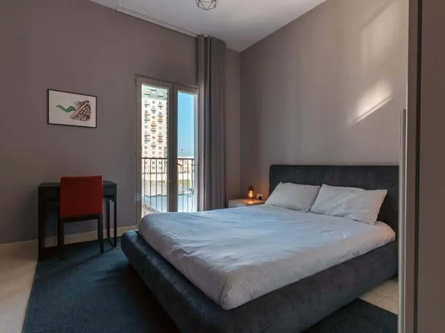 a bed with a white bedspread and a white bedspread 