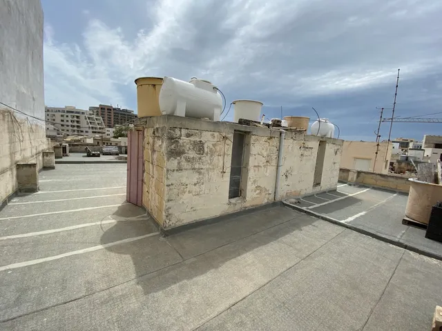 a wall with a bunch of graffiti on it 
