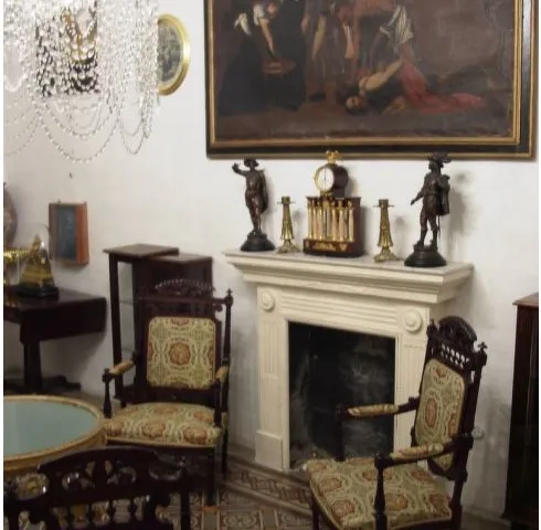 a fireplace with a painting on the wall