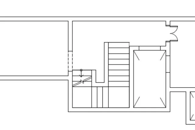 a large metal object is in the middle of a room