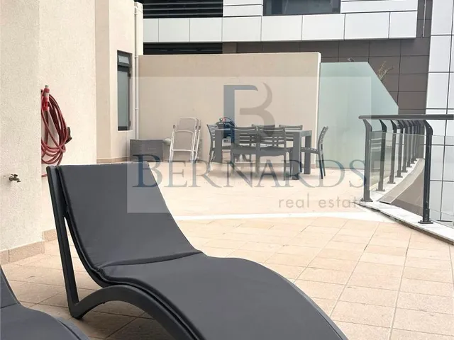 a chair and umbrella in a room
