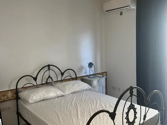 a bed with a white bedspread and a white bedspread 