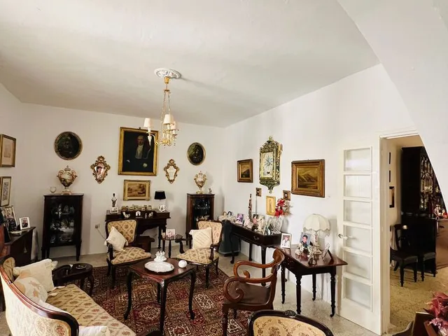 a living room filled with furniture and a fireplace