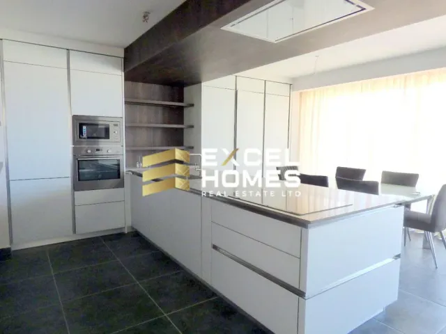 a kitchen with a sink, stove, refrigerator and a window