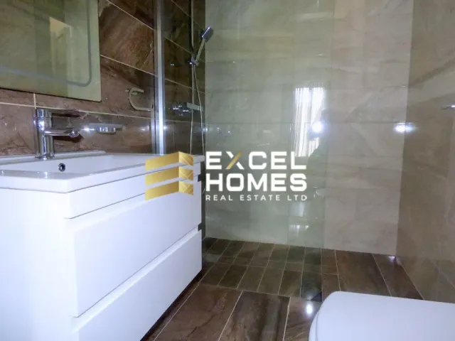 a bathroom with a white toilet and a tub