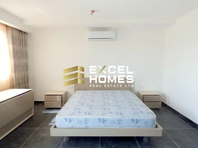 a bed room with a bed and a desk