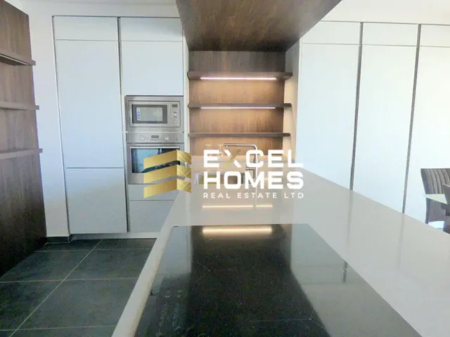 a kitchen with a door open and a door open