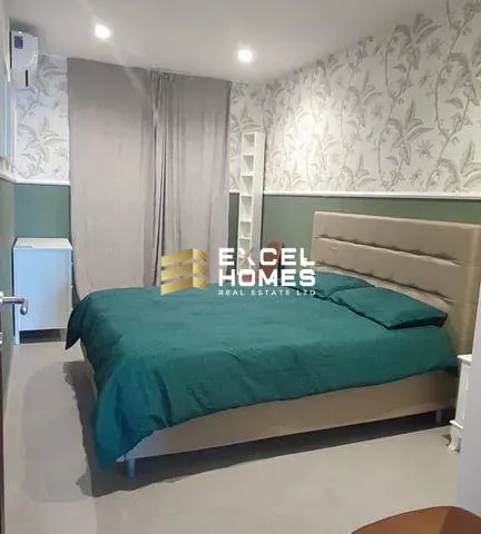 a bed with a blue blanket and a blue comforter 
