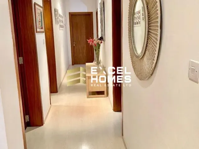 a person standing in a doorway looking in a mirror 