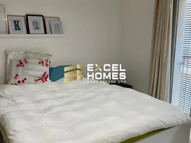a bed with a white bedspread and a white pillow 