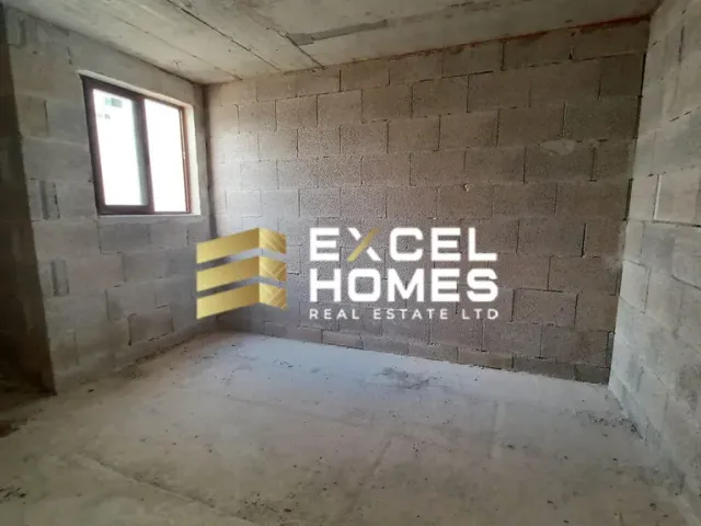 a wall with a graffiti covered wall and a brick wall