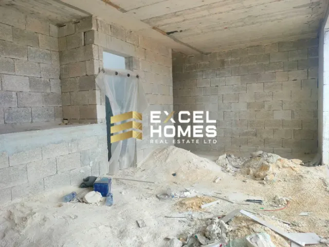 a wall with a broken down building and graffiti