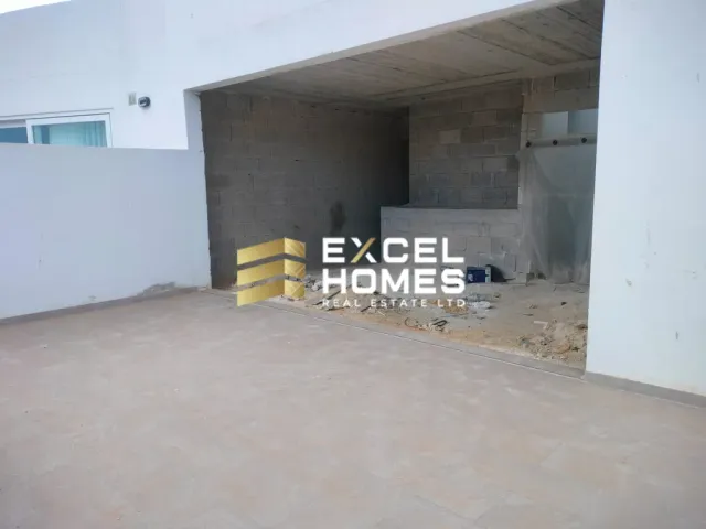 a wall with a broken down building and a broken down wall