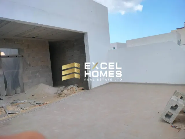 a dirty room with a broken wall and a broken toilet