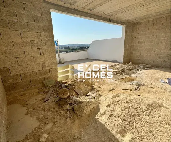 a room with a wall and a stone wall