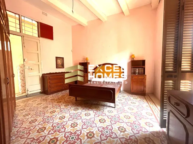 a living room with a large window and a large bed 