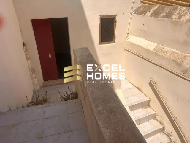 a doorway leading to a small room with a door 