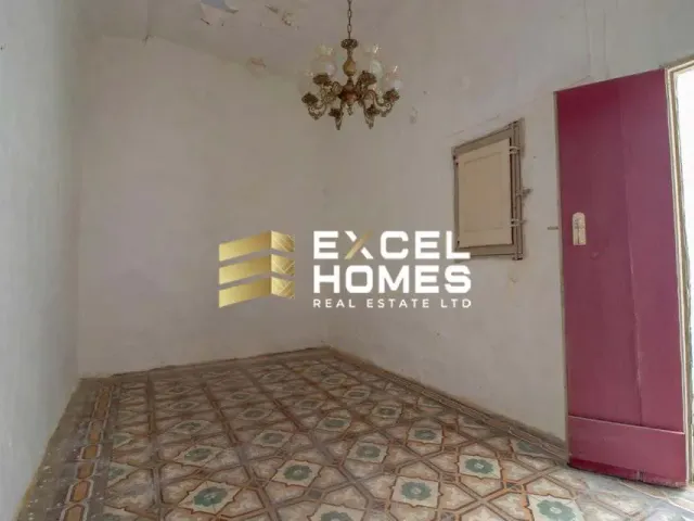 a room with a door open and a white rug 