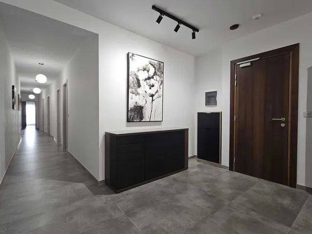 a large white clock sitting in a room