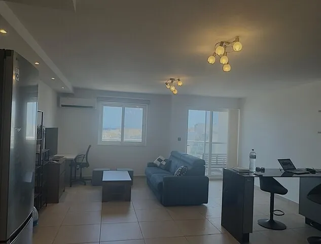 a living room with a couch, chair, and a tv
