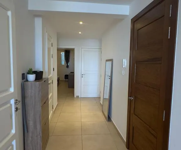 a kitchen with a door open and a door open