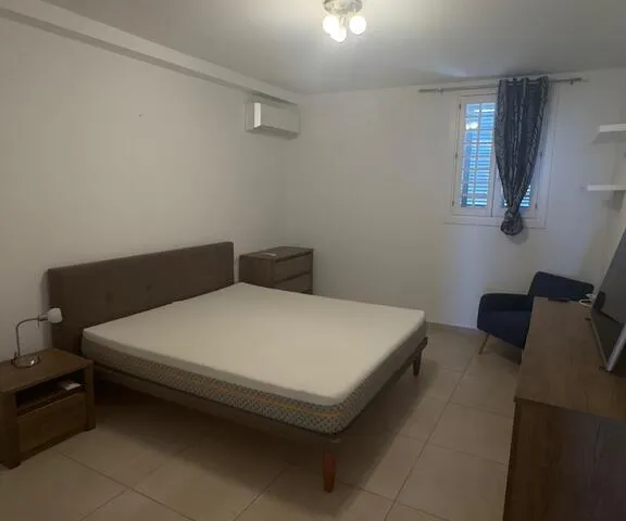 a bed room with a bed and a desk