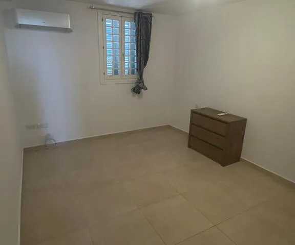 a room with a closet and a dresser